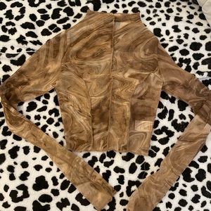 Naked Wardrobe’s mesh long - sleeved cropped top.